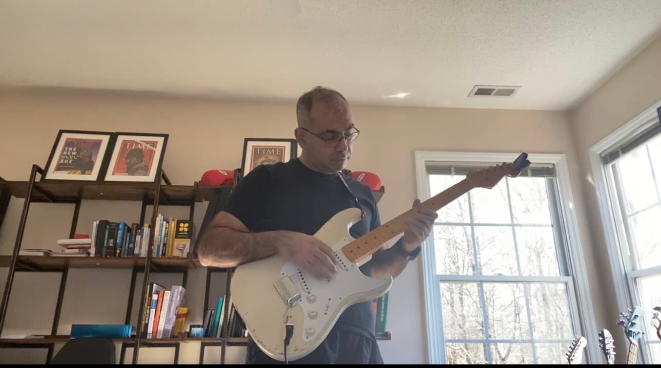 Playing electric guitar in the studio